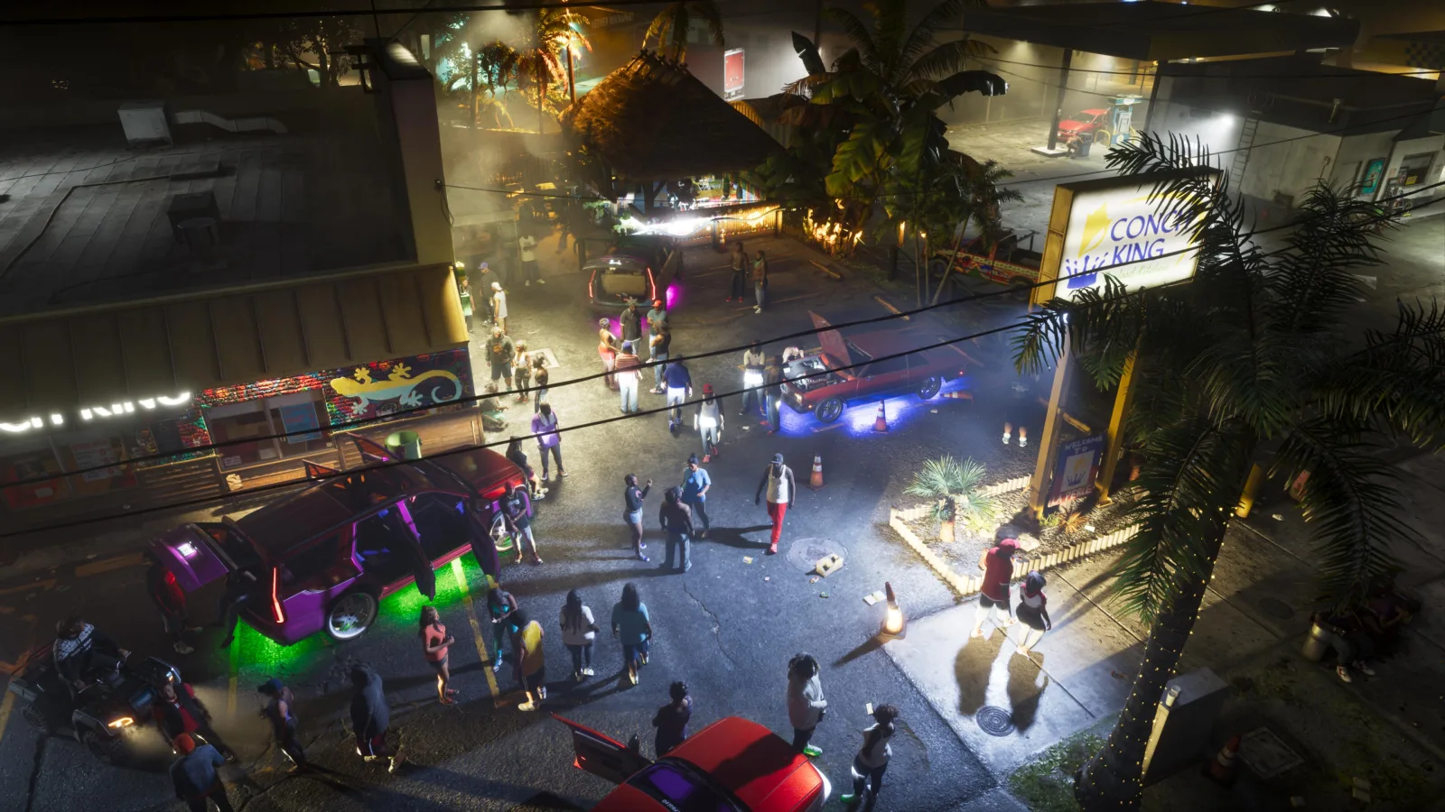 A night-time street party in a Leonida parking lot, cars with neon underglow and a crowd, from Rockstar's GTA VI Music page